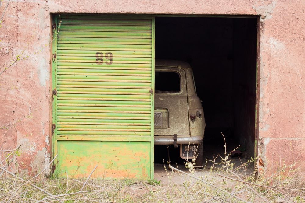 abandoned car in old garage